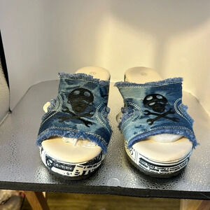 Wish denim sandals. With the skull and cross embroidery black on them. Size. 11​
